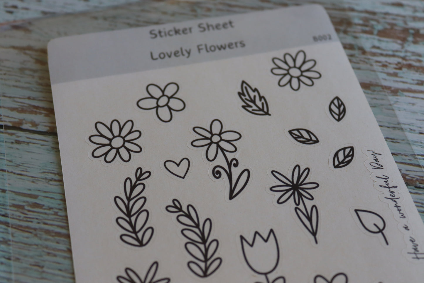 Detailaufnahme Stickerbogen. Verschiedene Blumen und Blätter mit einfacher Lineart.