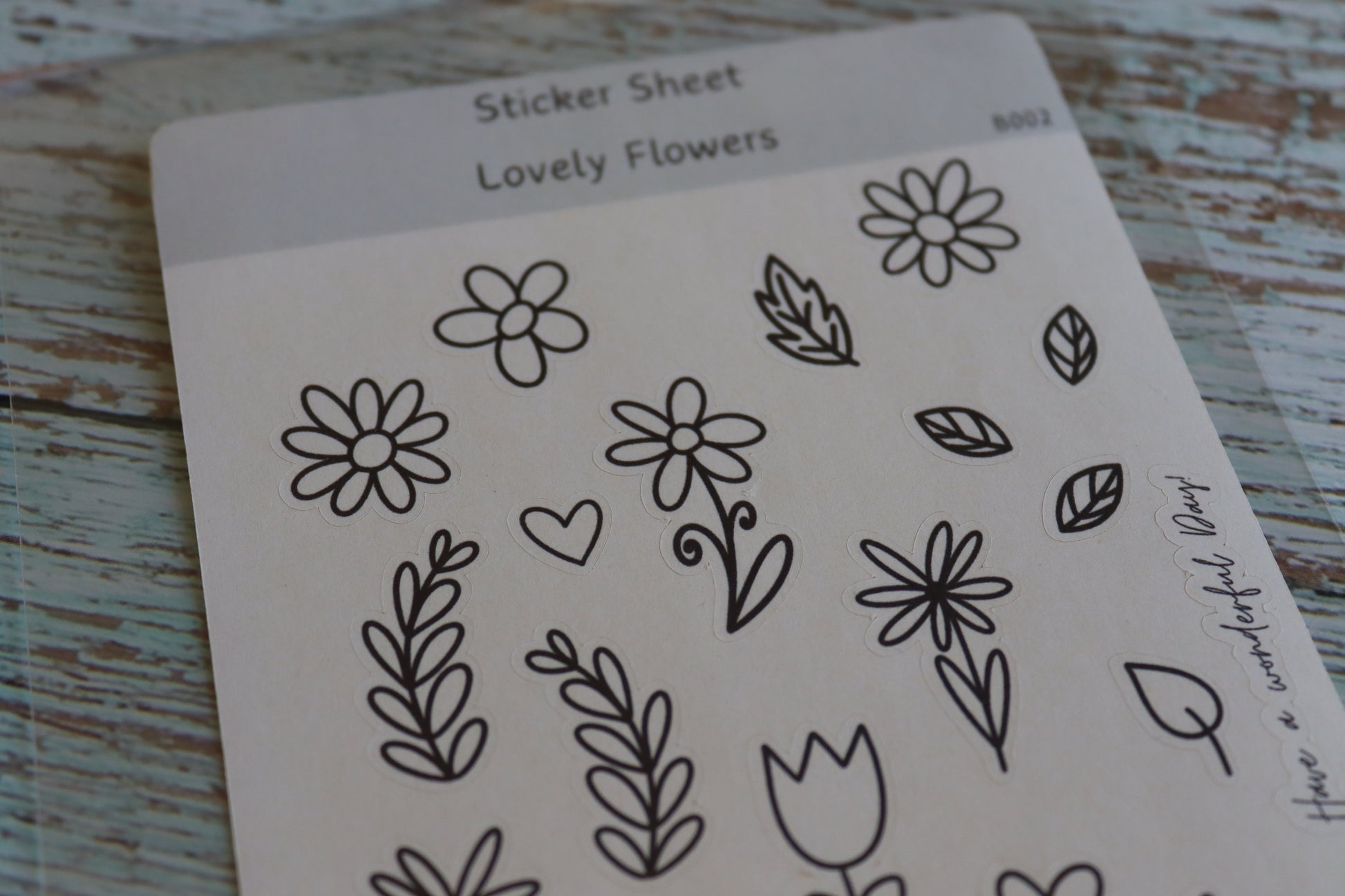 Detailaufnahme Stickerbogen. Verschiedene Blumen und Blätter mit einfacher Lineart.